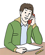 Mann telefoniert und hält Unterlagen in der Hand.